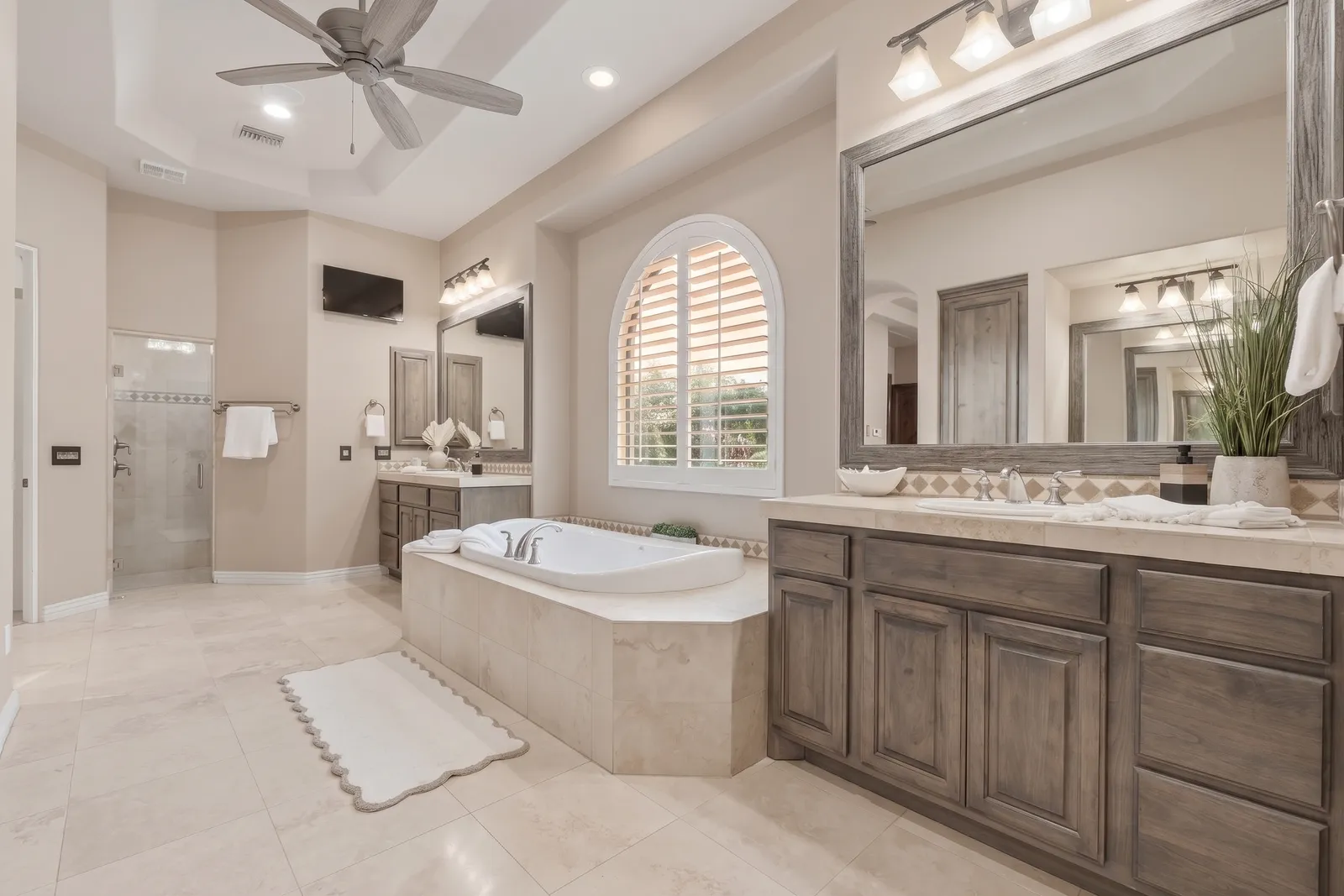 Arched plantation shutters in a Gilbert, Arizona bathroom