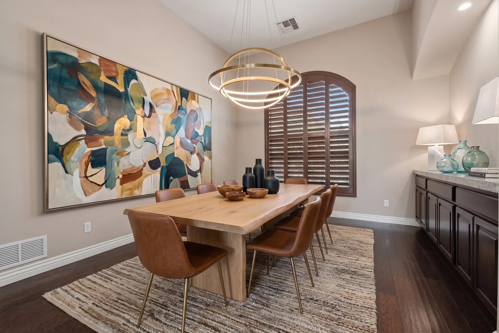 Arched wood plantation shutters in a Goodyear, Arizona dining room