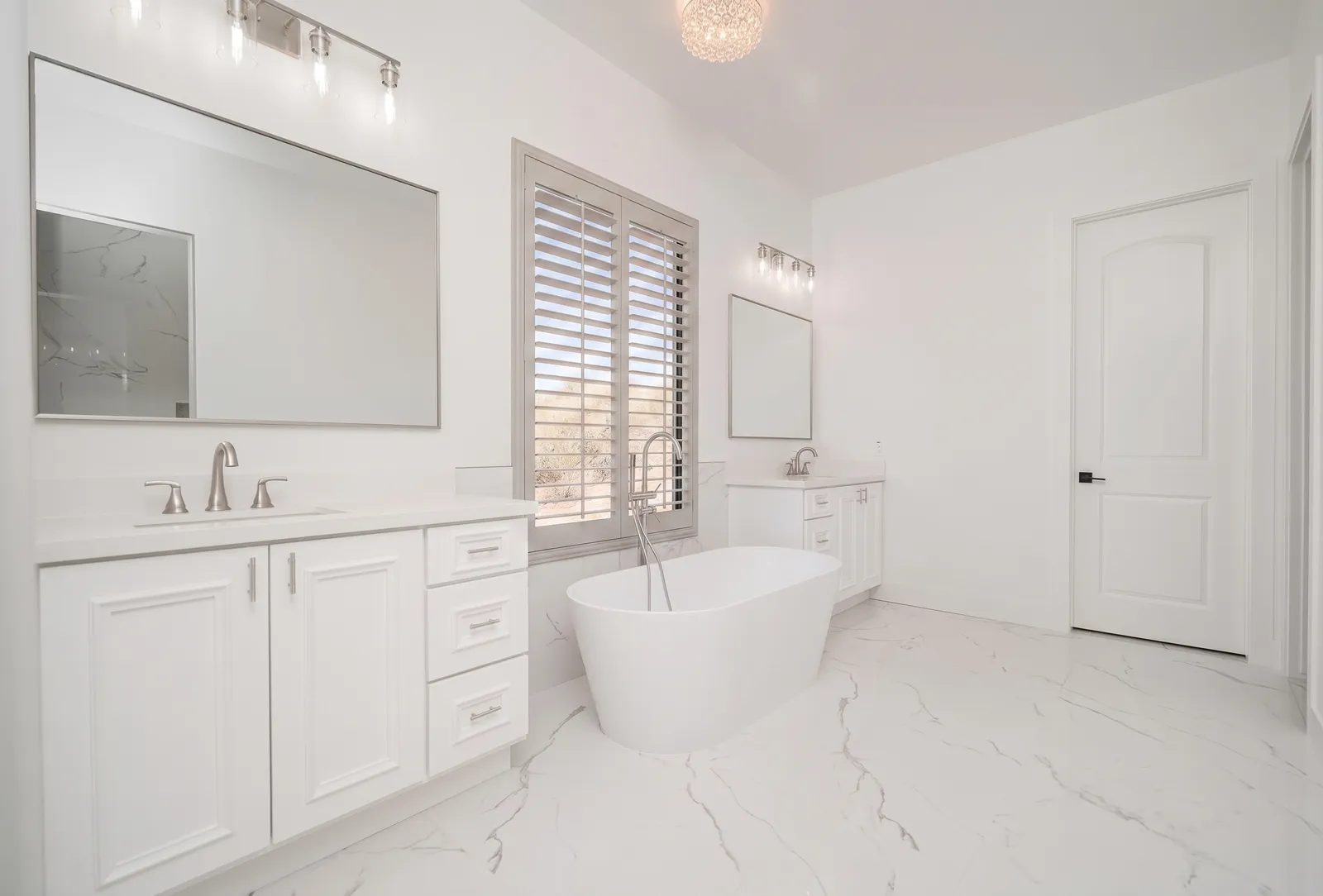 Soft-gray plantation shutters in a Peoria, Arizona bathroom