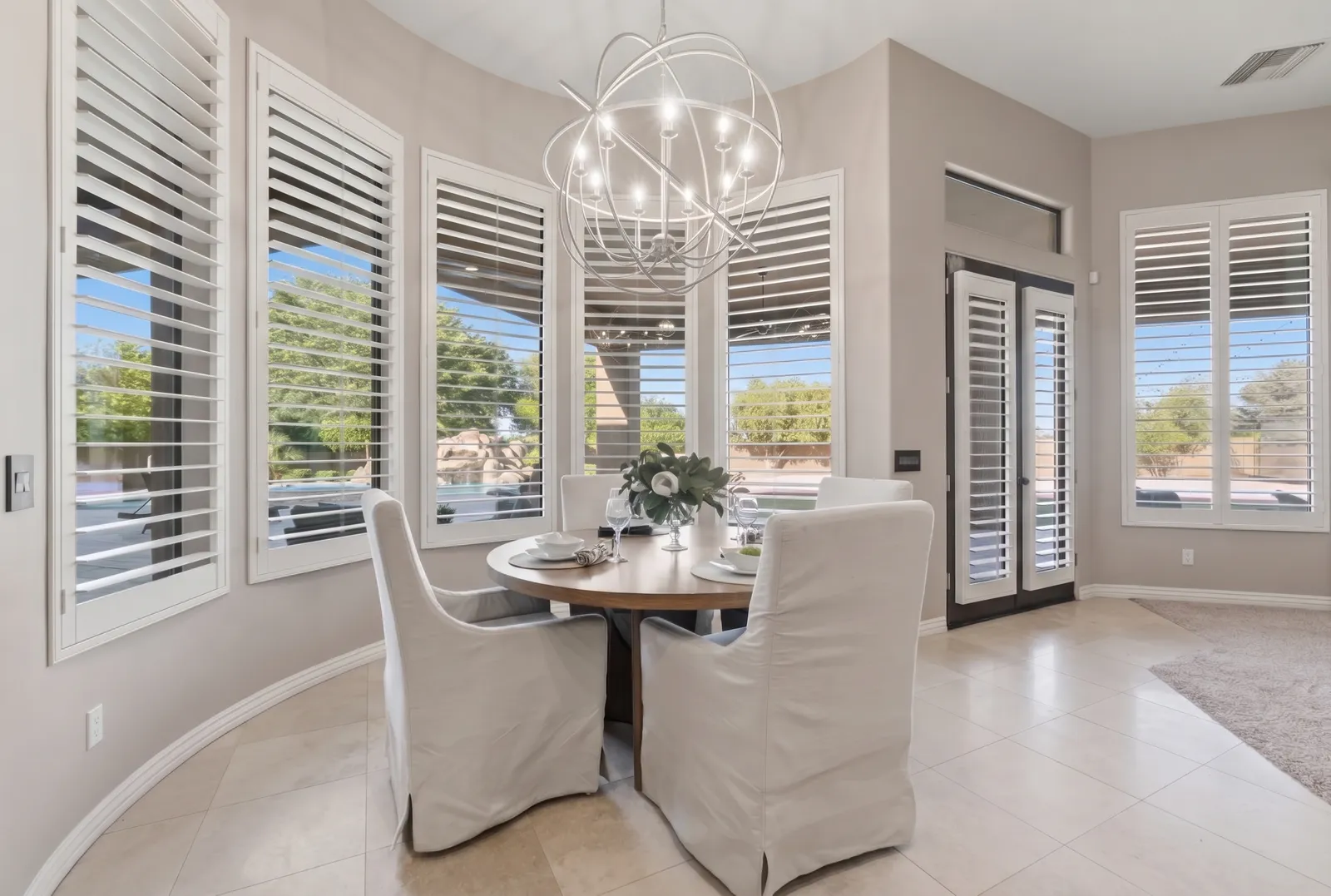 Plantation shutters controlling heat on a sunny bank of windows in a Scottsdale, Arizona home