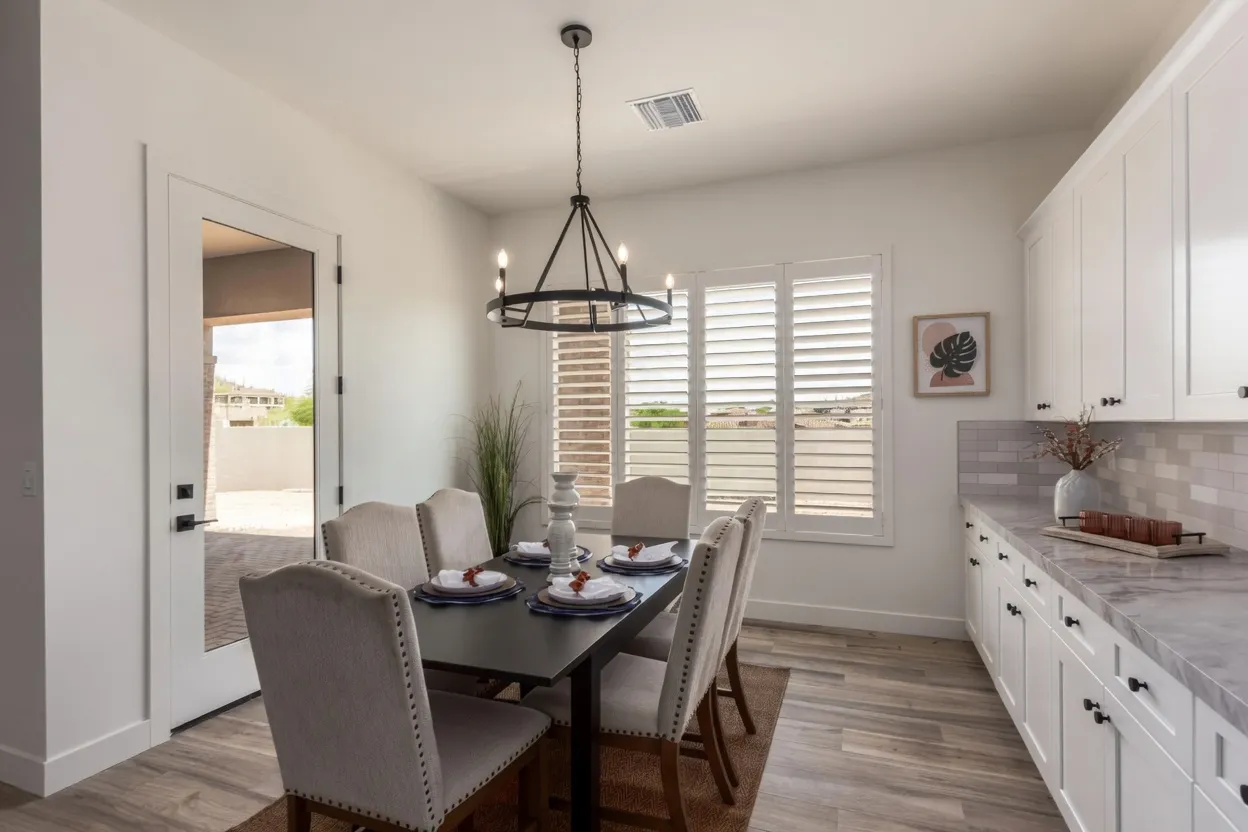 White composite plantation shutters on a tall window in a Gold Canyon, Arizona dining room
