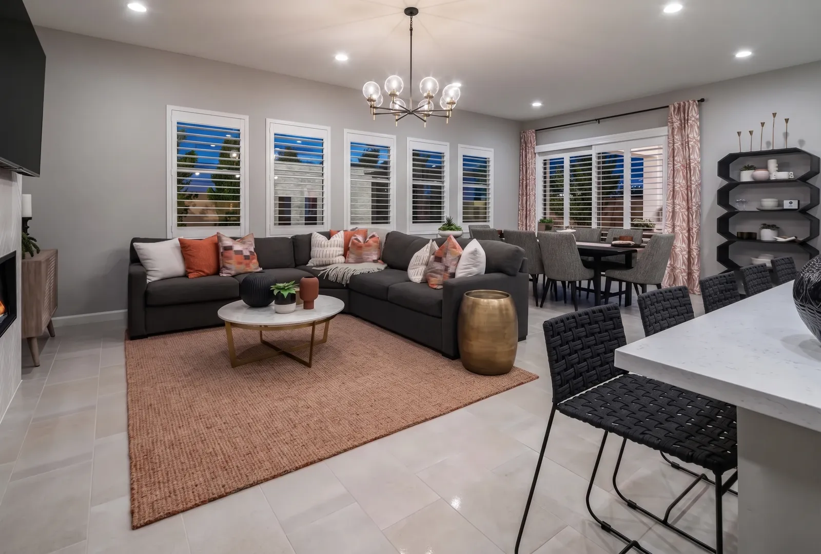 Durable white composite plantation shutters in a Scottsdale, Arizona family room