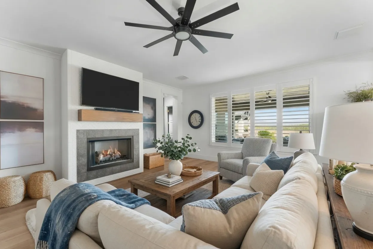 White composite plantation shutters on view windows in a Wickenburg, Arizona family room with a fireplace