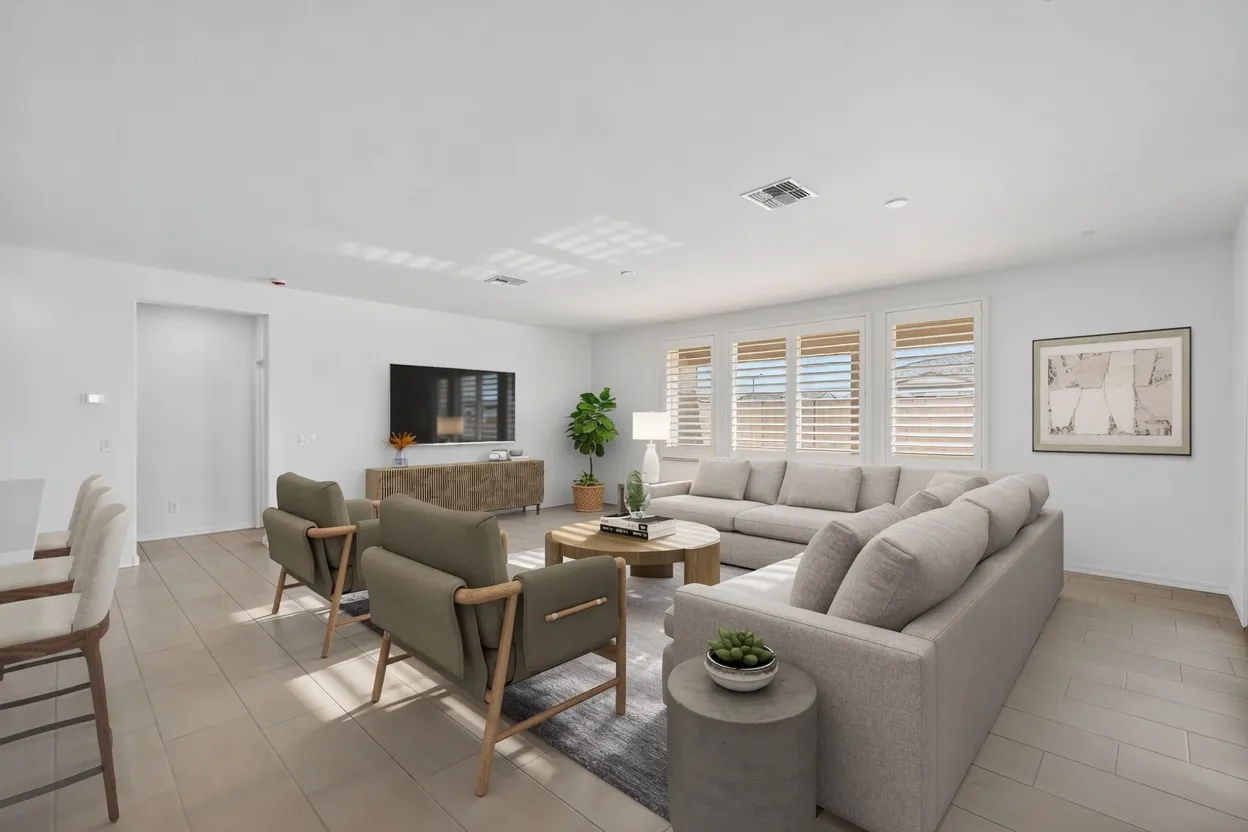 White composite plantation shutters with hidden tilt in a large open living room in Glendale, Arizona
