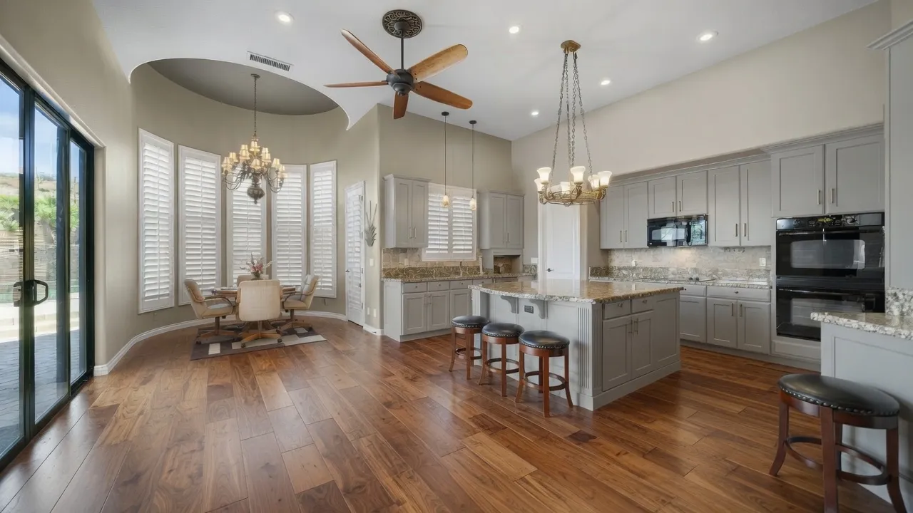 White wood plantation shutters on a curved bay window in a Gold Canyon, Arizona kitchen