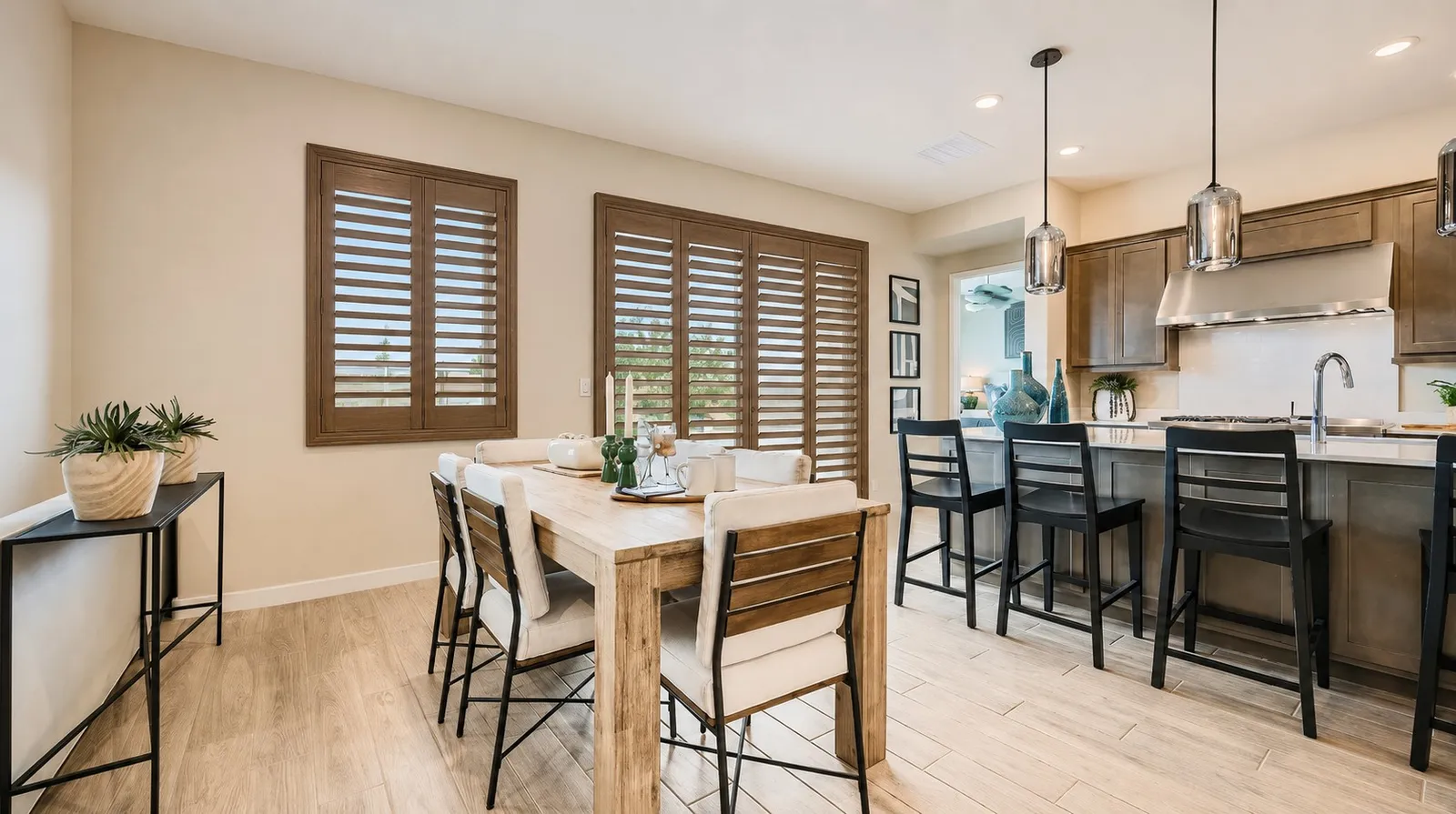 Stained wood plantation shutters in a San Tan Valley, Arizona kitchen and dining room